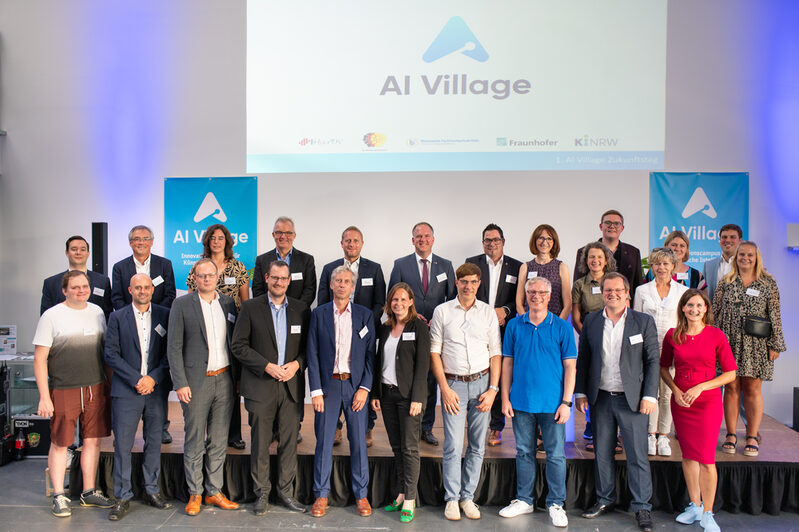 Gruppenfoto im AI Village mit allen Protagonisten